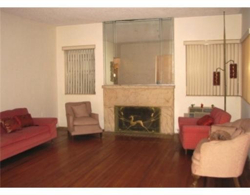 205 Southwest 21st Road Miami, FL 33129 - Photo 4 of 12 a living room with furniture and a fireplace