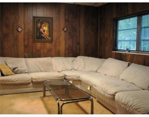 205 Southwest 21st Road Miami, FL 33129 - Photo 6 of 12 a living room with a couch and a window