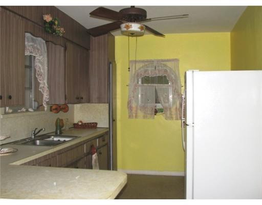 205 Southwest 21st Road Miami, FL 33129 - Photo 7 of 12 a bathroom with a sink a mirror and a shower