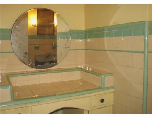 205 Southwest 21st Road Miami, FL 33129 - Photo 10 of 12 a bathroom with a glass shower door