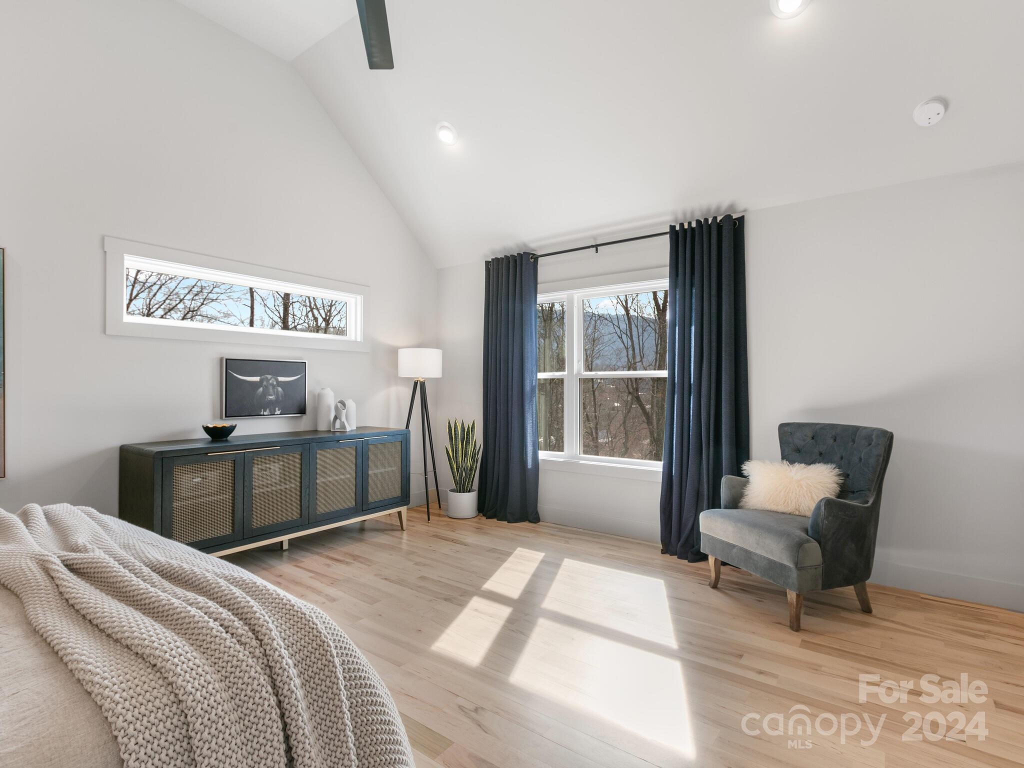 315 Porters Ridge Canton, NC 28716 - Photo 17 of 26 a bedroom with a bed and glass door