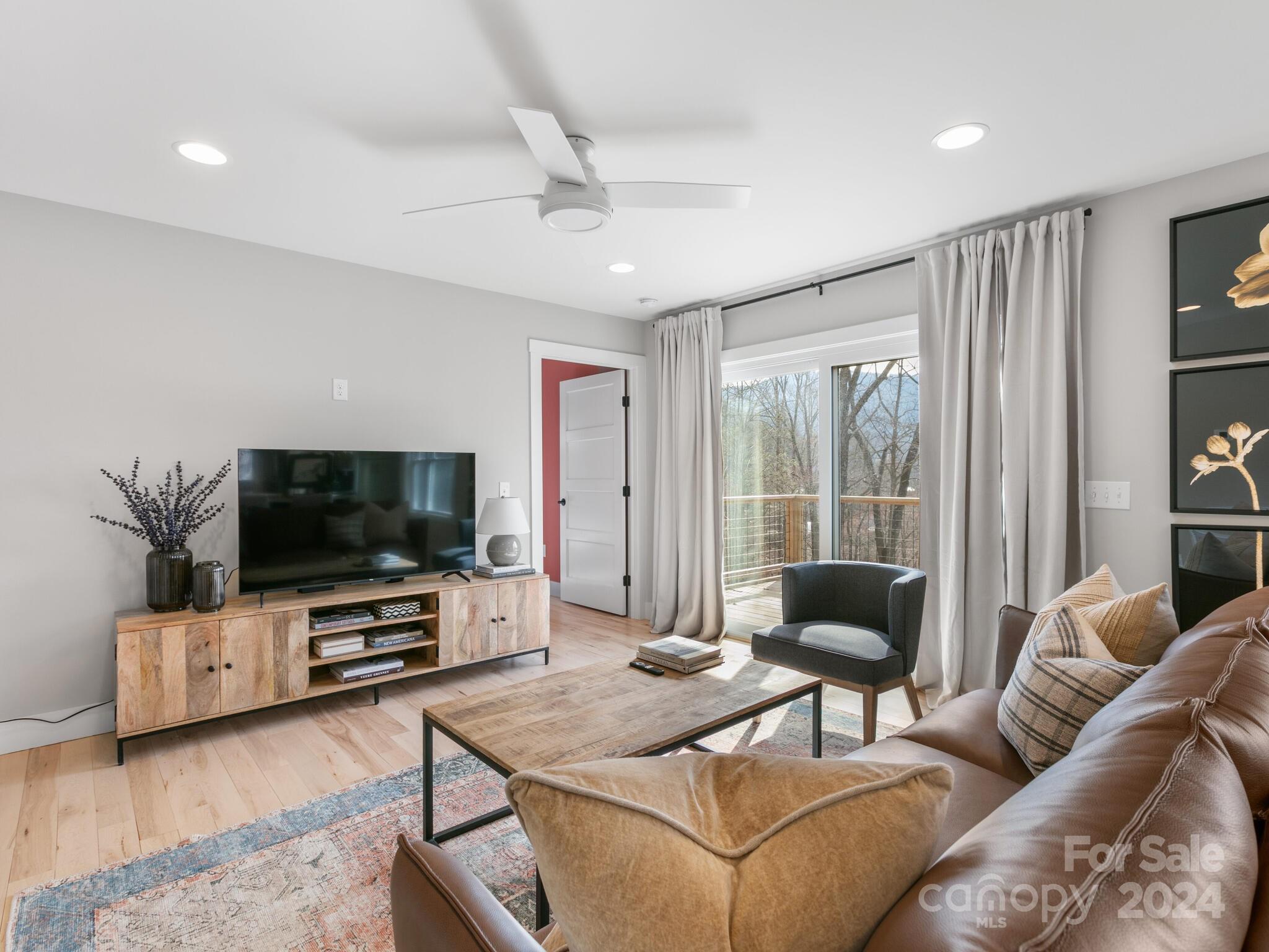 315 Porters Ridge Canton, NC 28716 - Photo 8 of 26 a living room with furniture and a flat screen tv