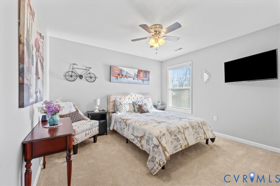 9119 Clearbrook Court Chesterfield, VA 23832 - Photo 35 of 50 a bedroom with a bed and a chandelier