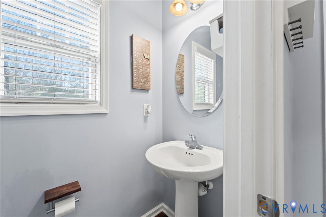 9119 Clearbrook Court Chesterfield, VA 23832 - Photo 9 of 50 a bathroom with a sink a mirror and a window