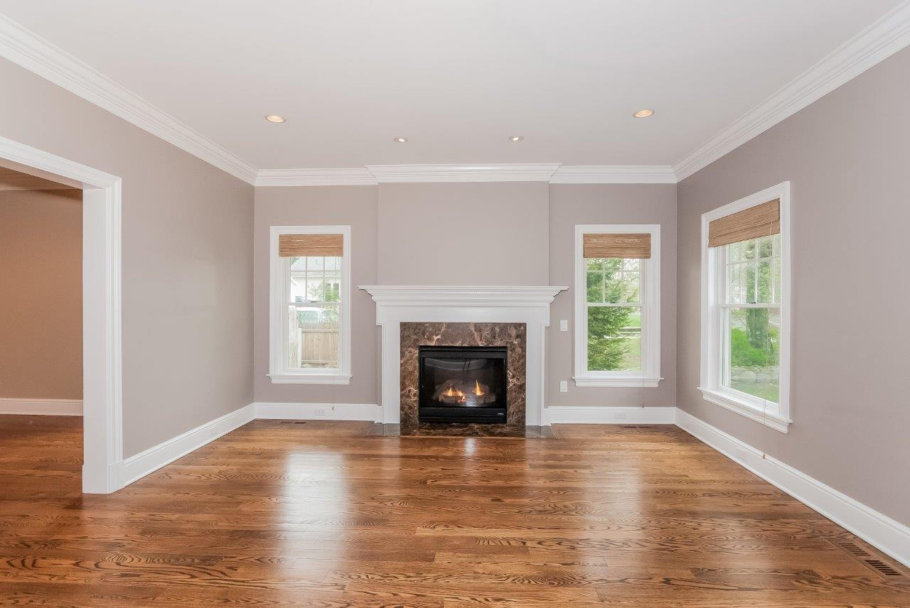 44 Gower Road New Canaan, CT 06840 - Photo 13 of 53 an empty room with windows and a fireplace
