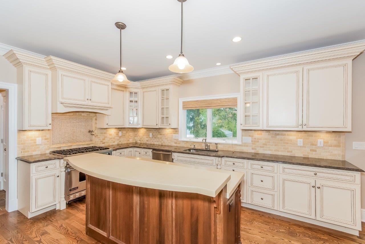 44 Gower Road New Canaan, CT 06840 - Photo 23 of 53 a kitchen with a sink a window and cabinets