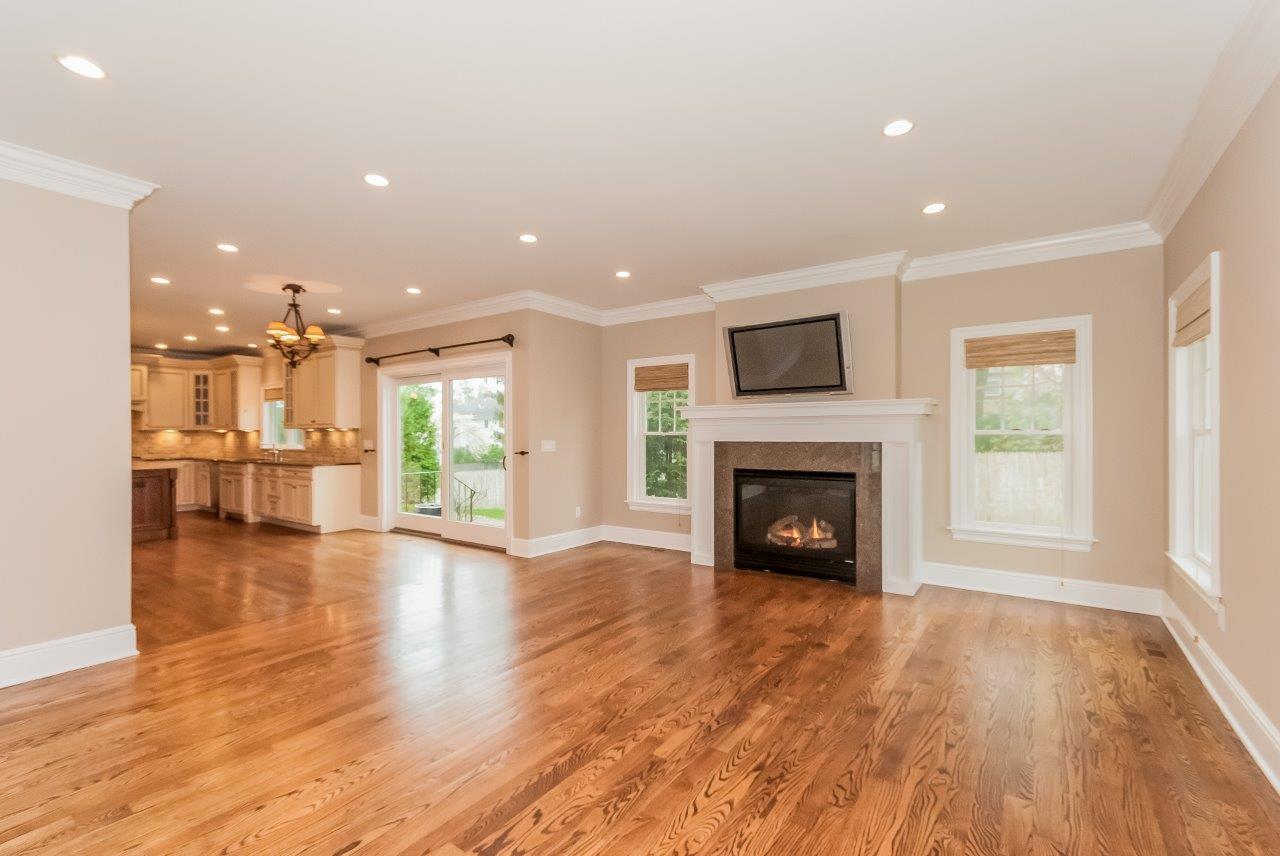 44 Gower Road New Canaan, CT 06840 - Photo 28 of 53 a view of a livingroom with a fireplace wooden floor and fire place