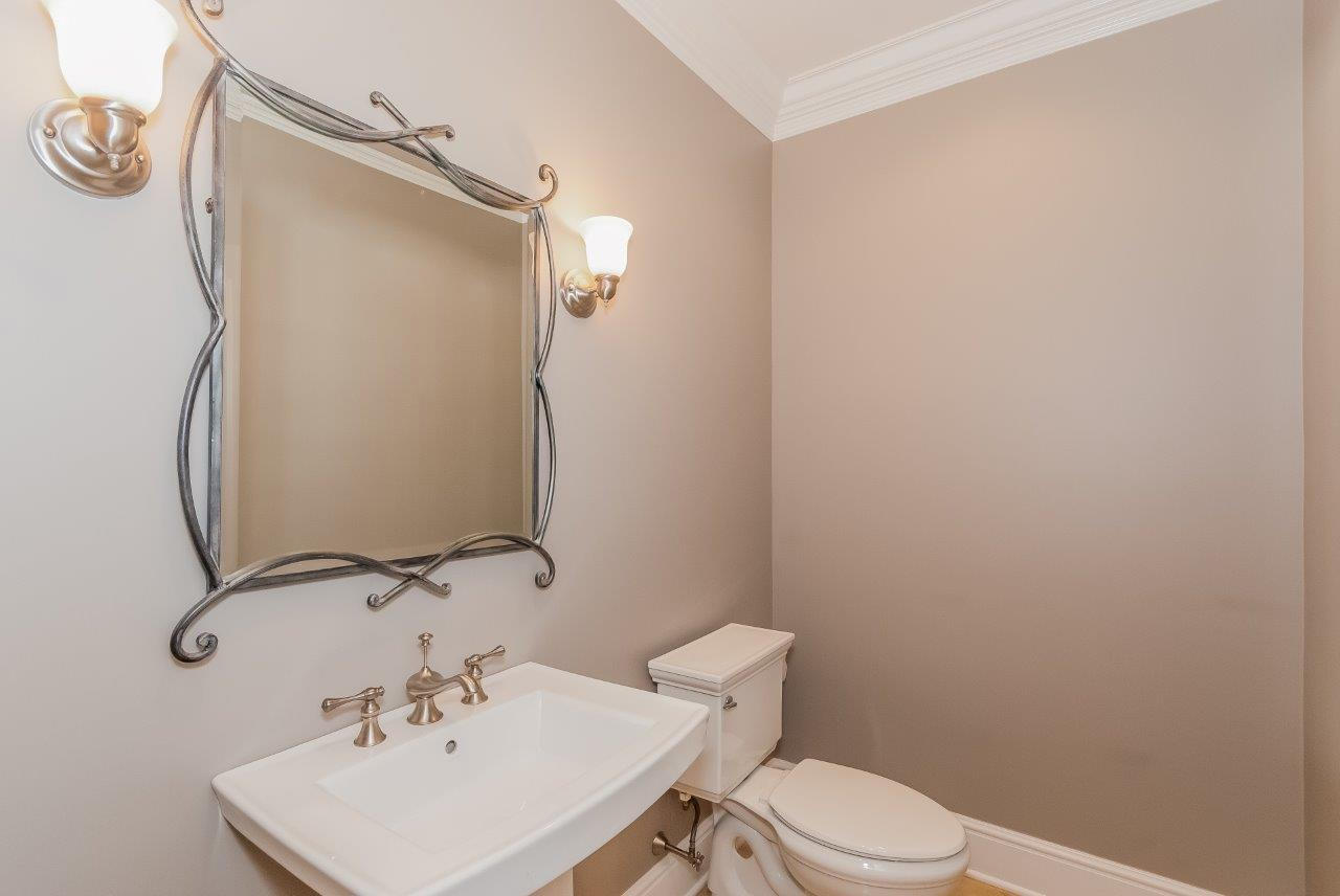 44 Gower Road New Canaan, CT 06840 - Photo 32 of 53 a bathroom with a sink a toilet and mirror