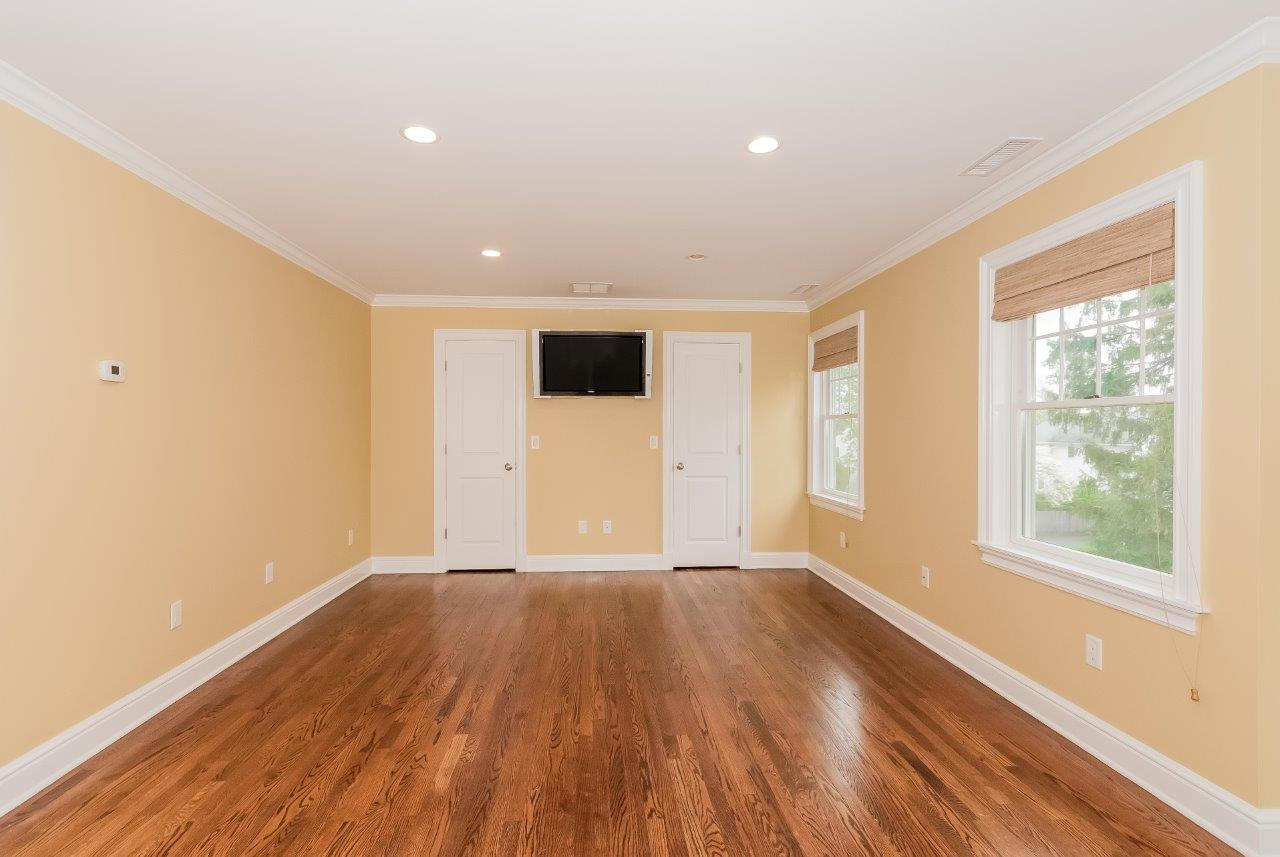 44 Gower Road New Canaan, CT 06840 - Photo 35 of 53 a view of an empty room with wooden floor and a window