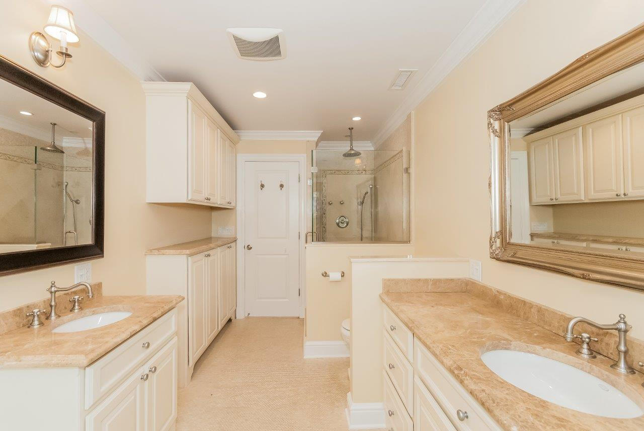 44 Gower Road New Canaan, CT 06840 - Photo 40 of 53 a spacious bathroom with a granite countertop sink mirror and a