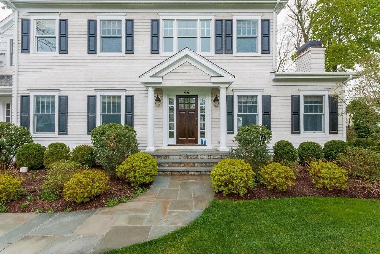 44 Gower Road New Canaan, CT 06840 - Photo 4 of 53 front view of a house with a yard