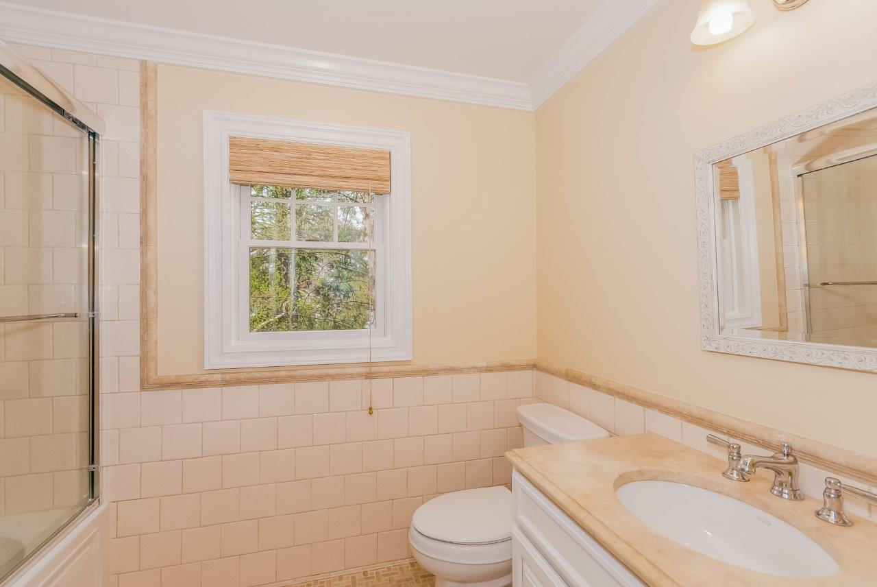 44 Gower Road New Canaan, CT 06840 - Photo 41 of 53 a bathroom with a sink a toilet and window
