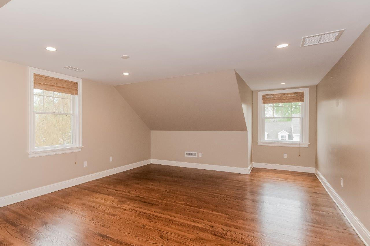 44 Gower Road New Canaan, CT 06840 - Photo 43 of 53 an empty room with wooden floor and windows