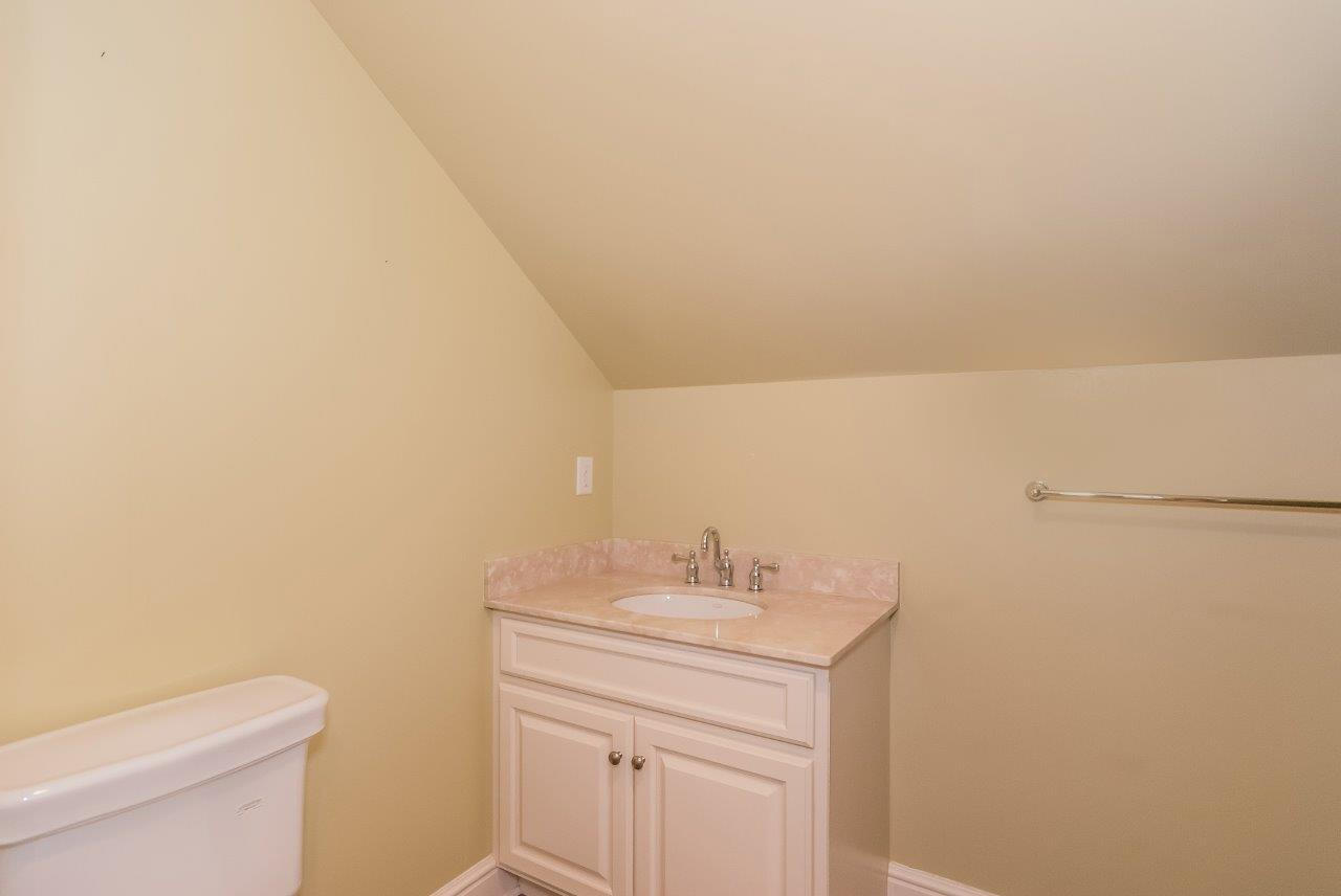 44 Gower Road New Canaan, CT 06840 - Photo 44 of 53 a bathroom with a sink a toilet and vanity