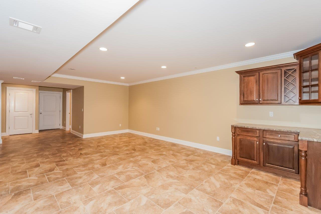 44 Gower Road New Canaan, CT 06840 - Photo 46 of 53 a view of an empty room with cabinet and a window