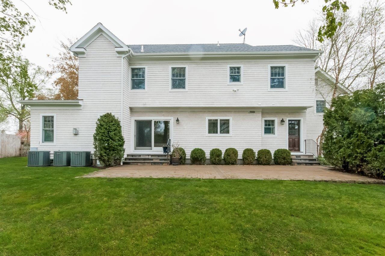 44 Gower Road New Canaan, CT 06840 - Photo 6 of 53 front view of a house with a yard
