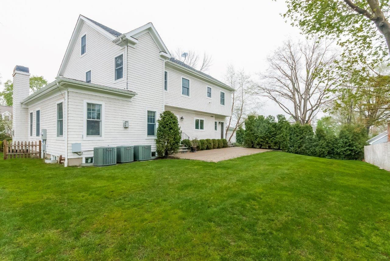 44 Gower Road New Canaan, CT 06840 - Photo 7 of 53 a view of a house with a yard and sitting area