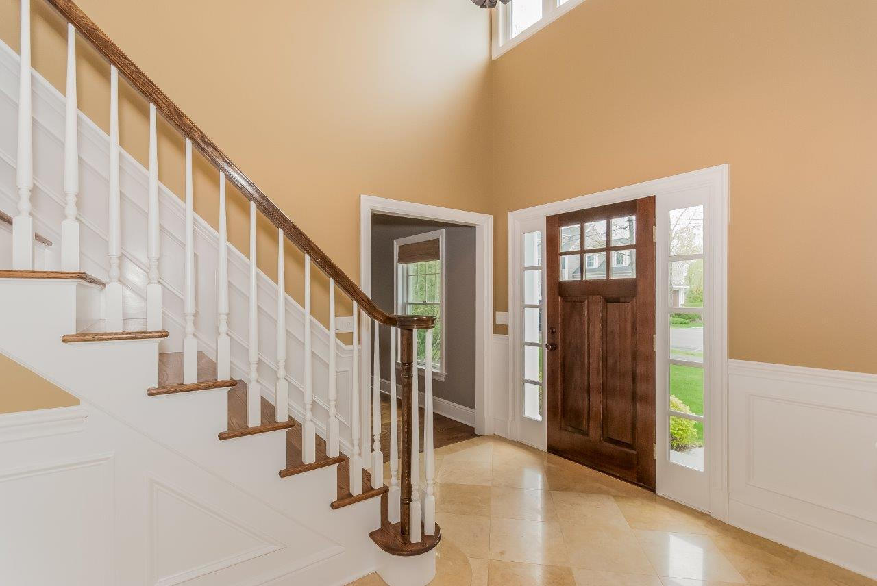 44 Gower Road New Canaan, CT 06840 - Photo 10 of 53 a view of staircase with lots of frames and couches