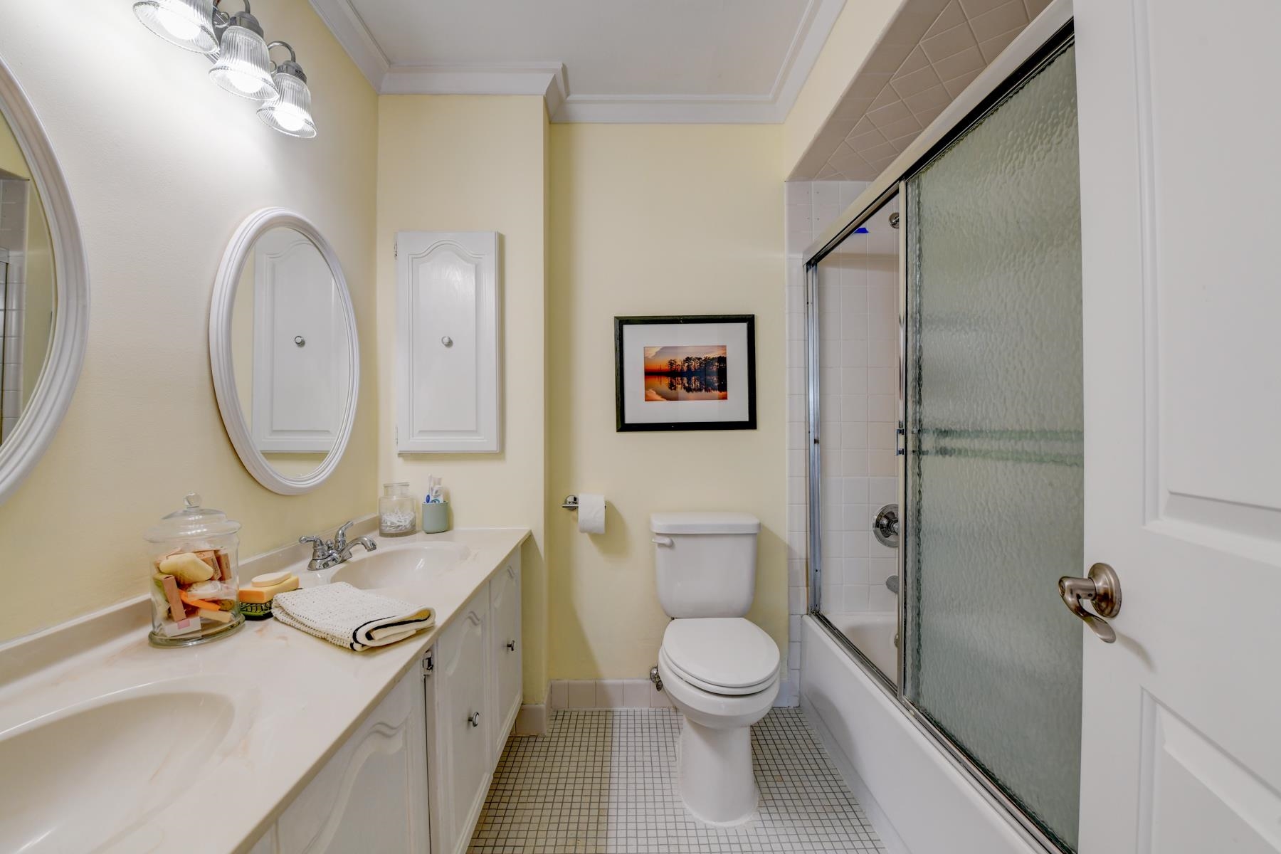 598 Sanderling Court, Unit 598 Secaucus, NJ 07094 - Photo 11 of 22 a bathroom with a toilet a sink a mirror and a shower