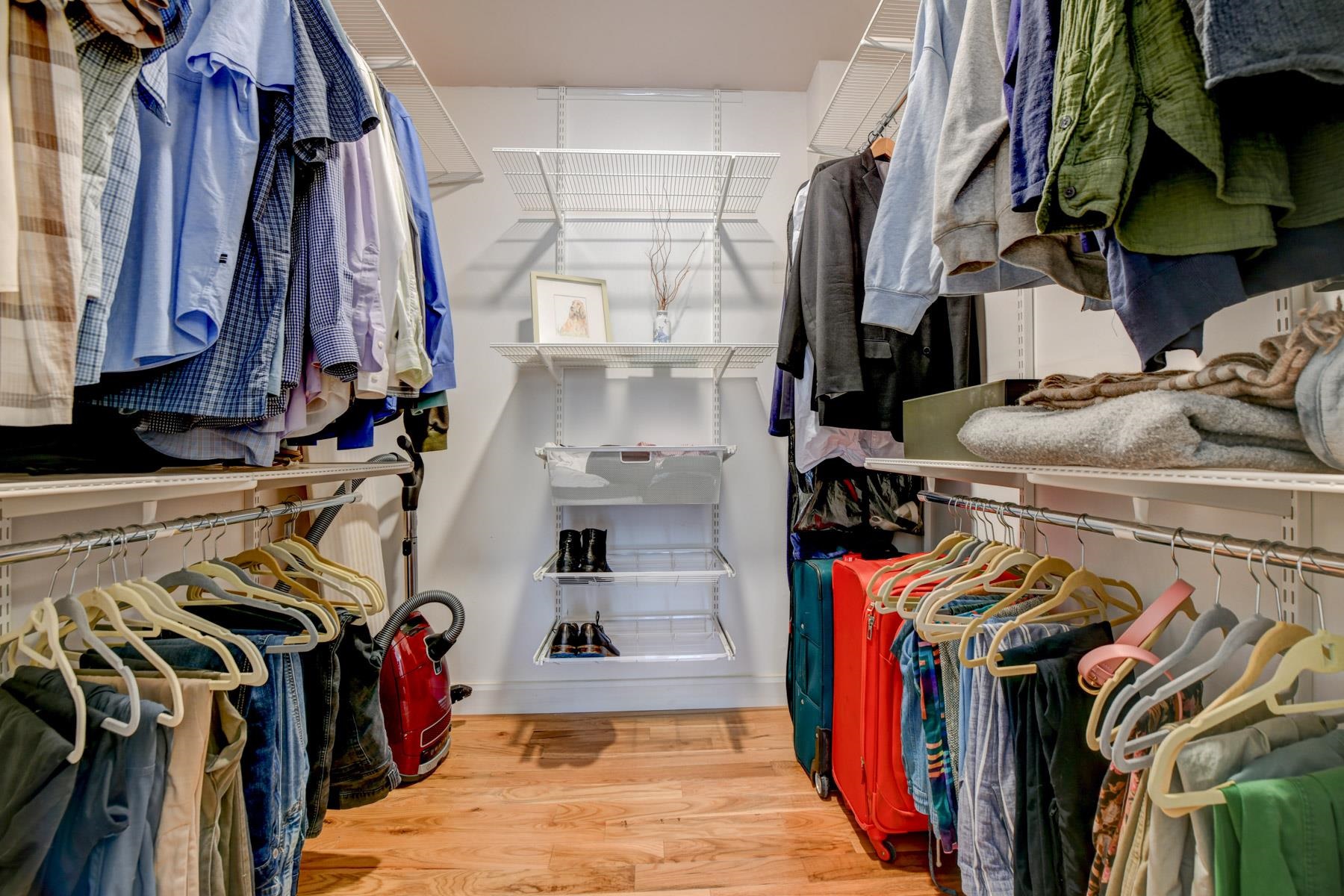 598 Sanderling Court, Unit 598 Secaucus, NJ 07094 - Photo 12 of 22 a view of walk in closet with clothes and shoes