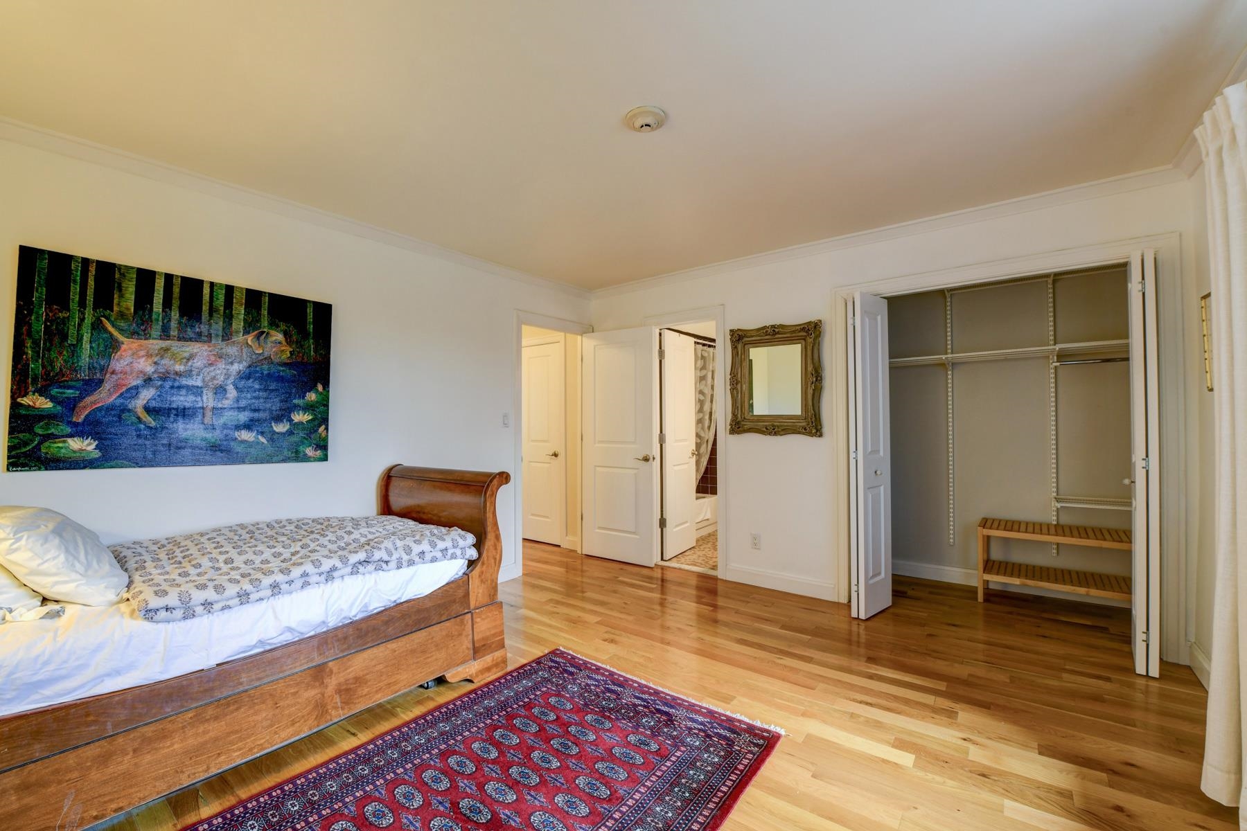 598 Sanderling Court, Unit 598 Secaucus, NJ 07094 - Photo 15 of 22 a bedroom with a bed and wooden floor