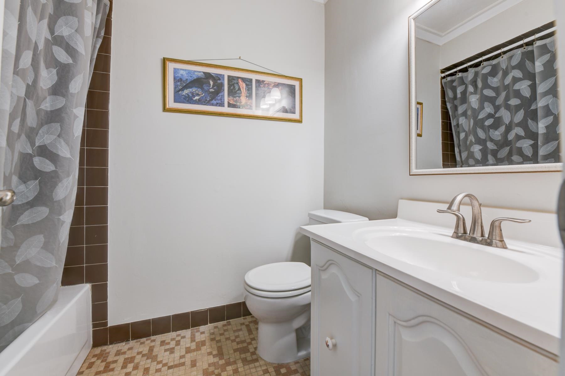 598 Sanderling Court, Unit 598 Secaucus, NJ 07094 - Photo 16 of 22 a bathroom with a toilet a sink and a mirror