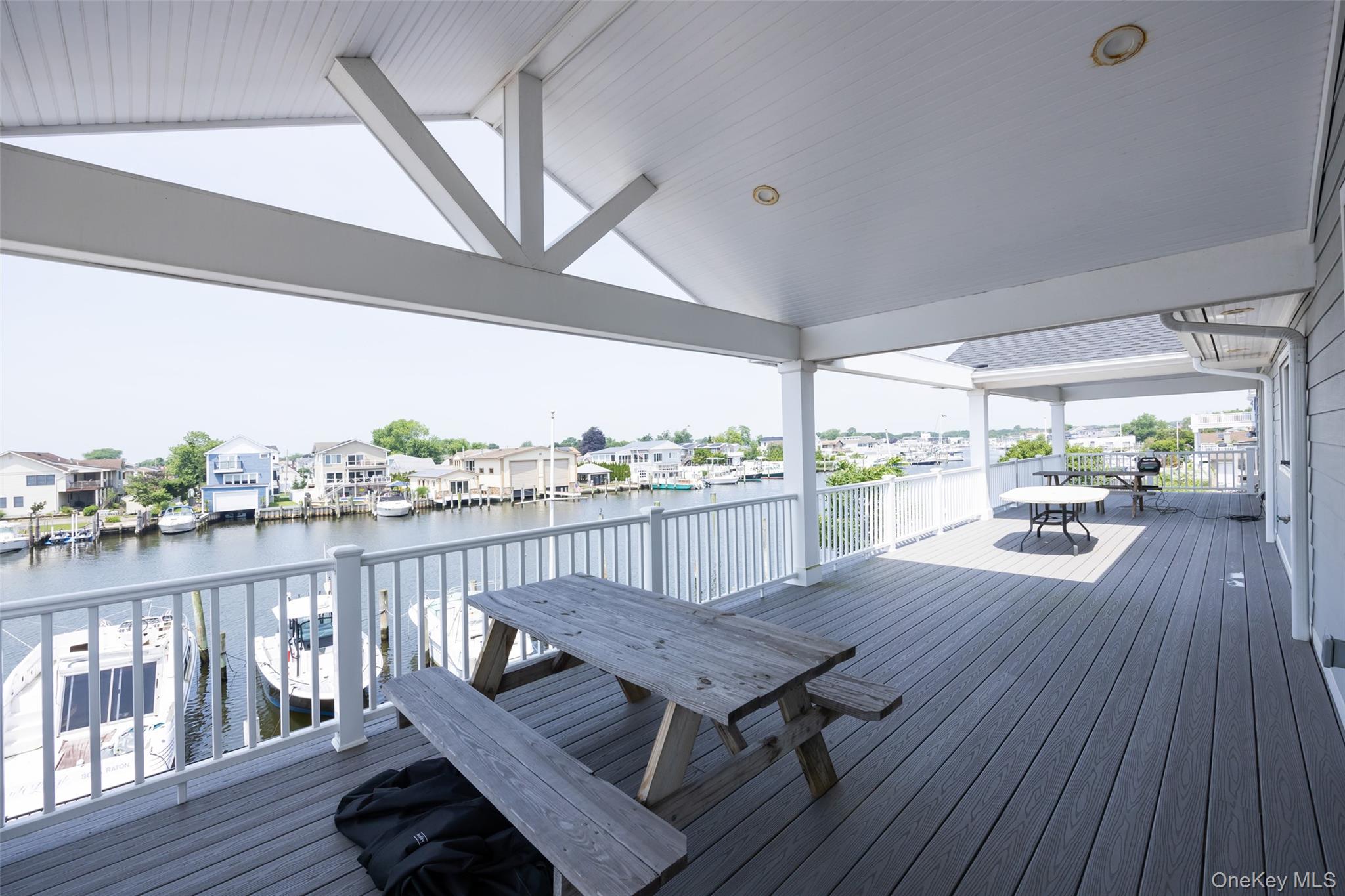 390 East Shore Road Lindenhurst, NY 11757 - Photo 25 of 27 a view of a balcony with wooden floor