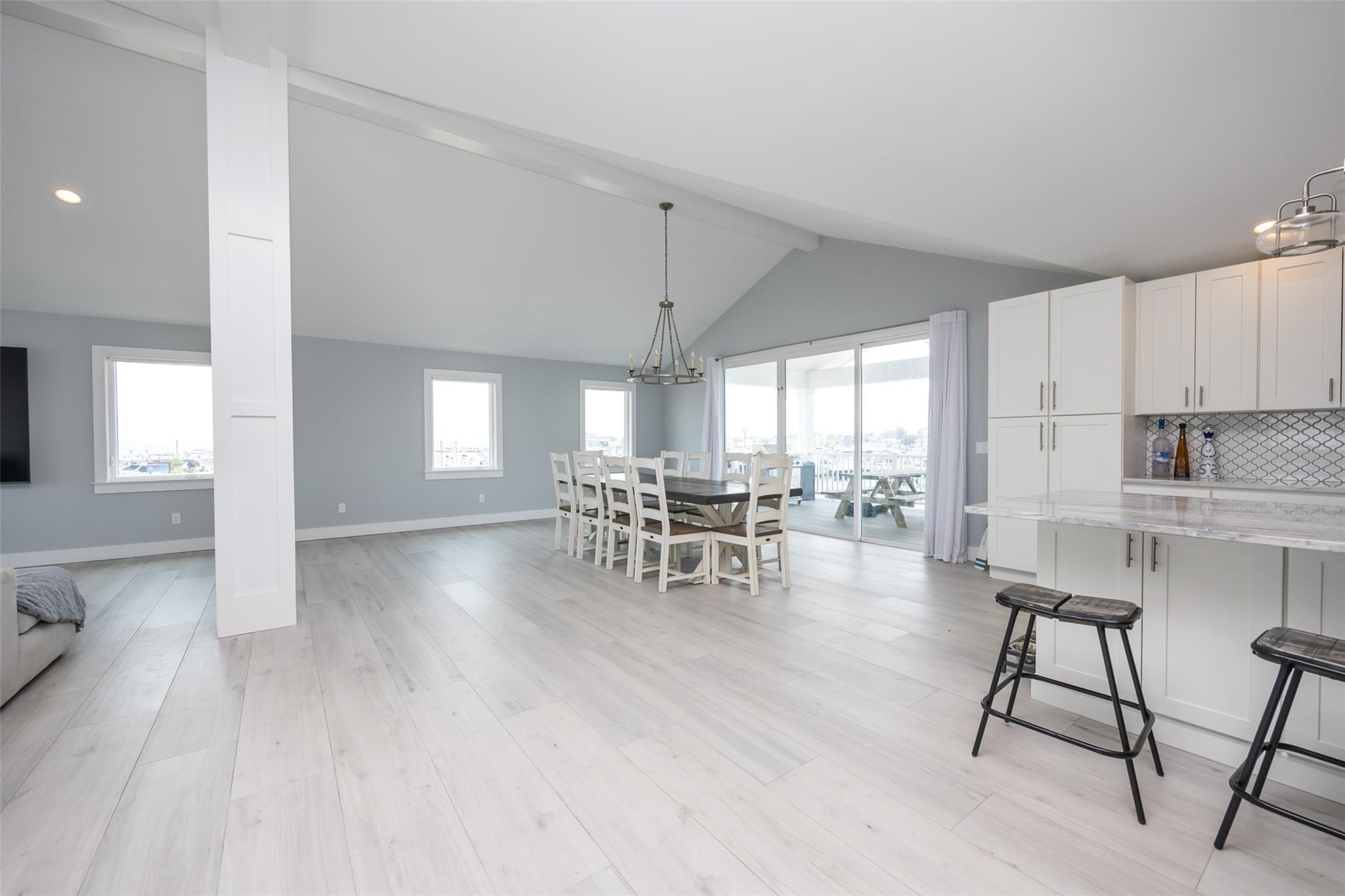 390 East Shore Road Lindenhurst, NY 11757 - Photo 10 of 27 Dining space featuring light wood-style floors, a chandelier, and recessed lighting
