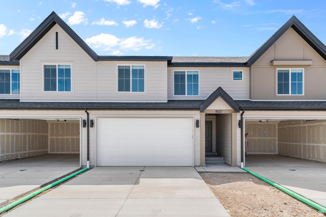 1907 East 640th North, Unit 1225 Salem, UT 84653 - Photo 11 of 20 Contemporary townhome exterior featuring light-colored siding with dark trim accents