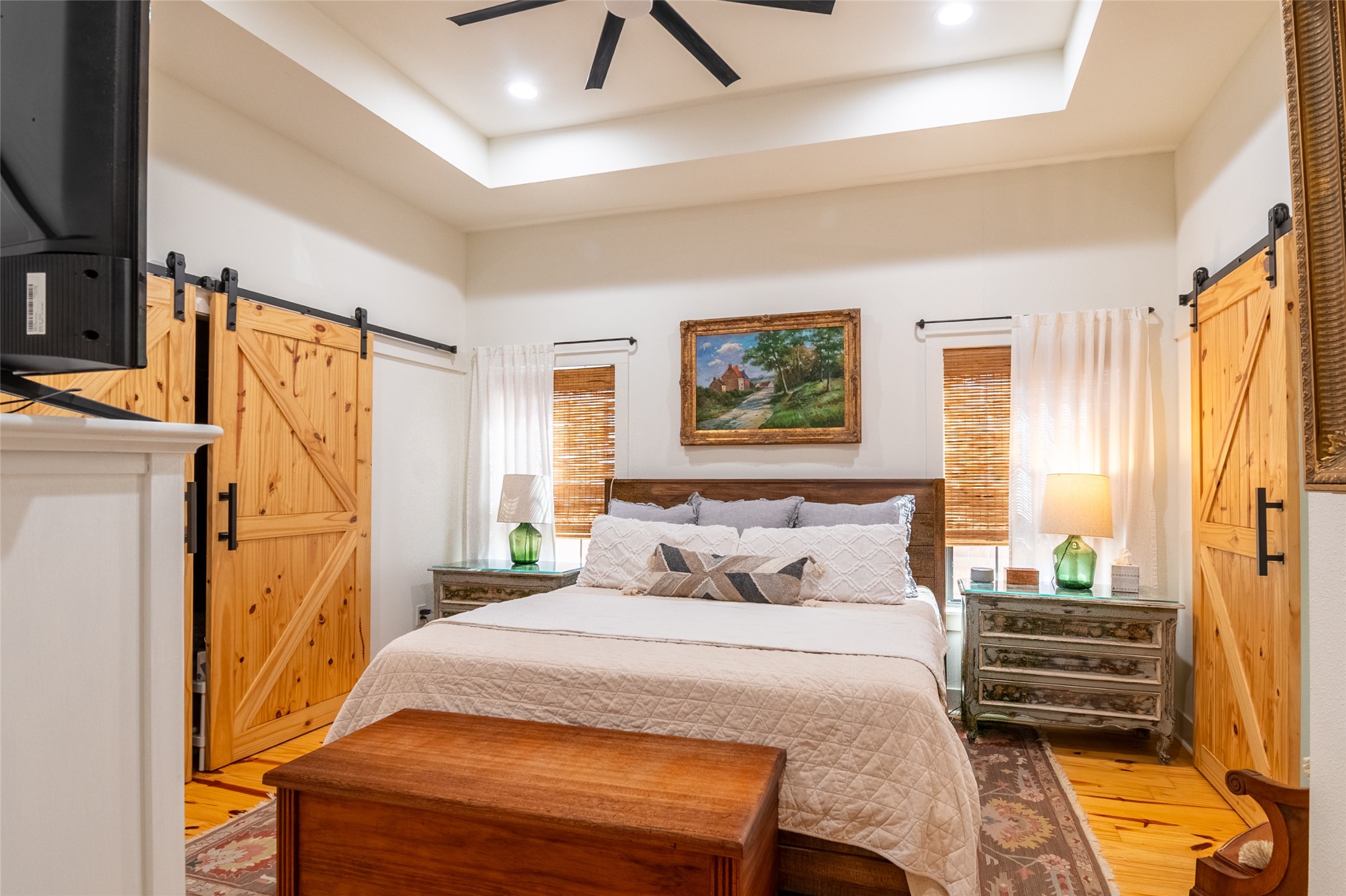 200 Carl Street Houston, TX 77009 - Photo 18 of 32 a bedroom with a bed wooden floor and window