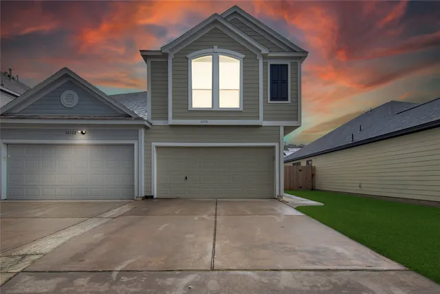 a front view of a house with a garage