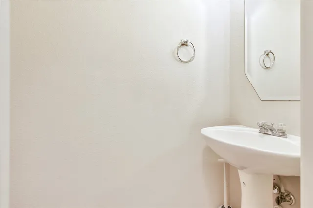 a bathroom with a sink and mirror