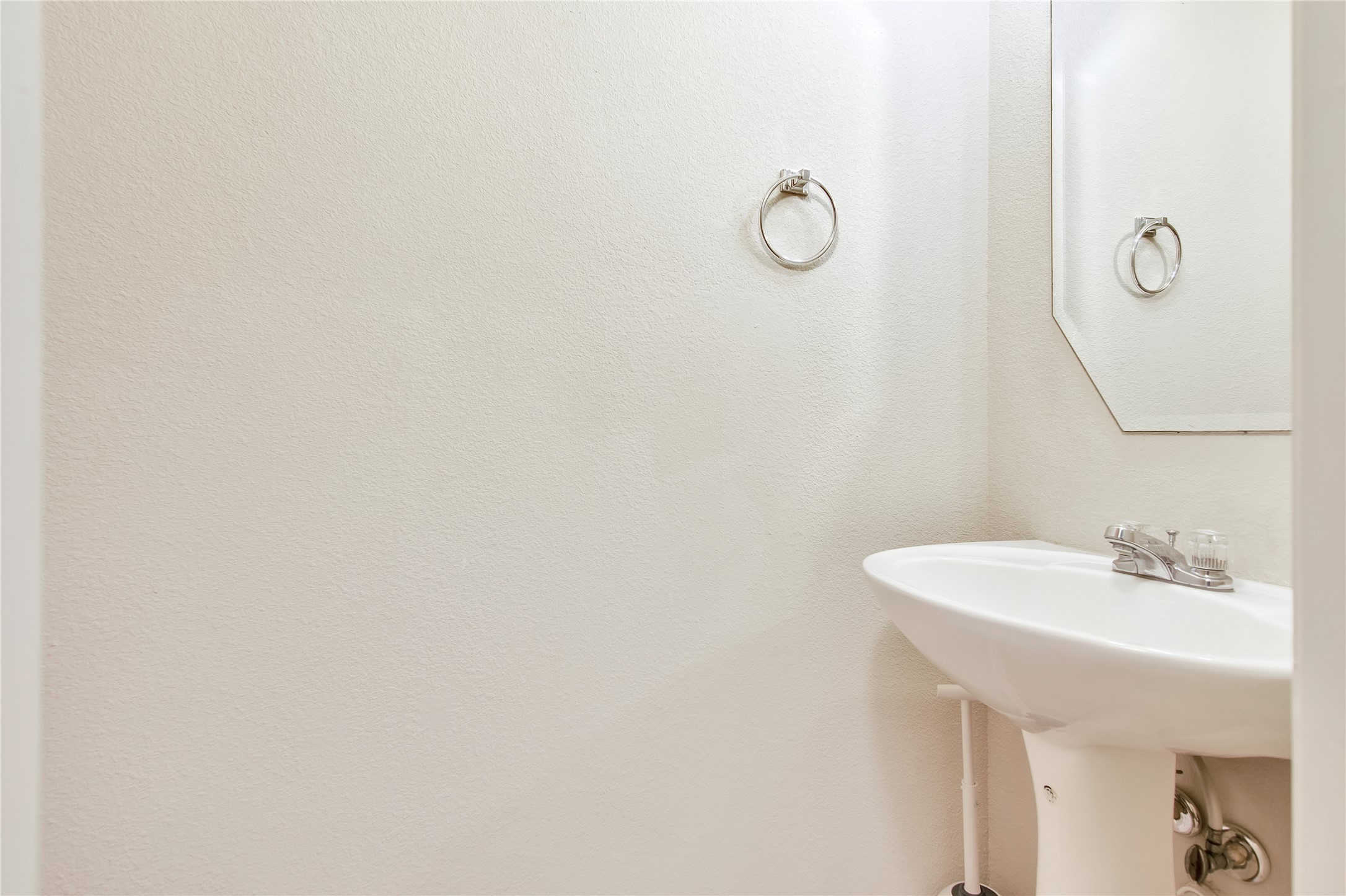 16518 Strathmore Manor Lane Houston, TX 77090 - Photo 12 of 25 a bathroom with a sink and mirror