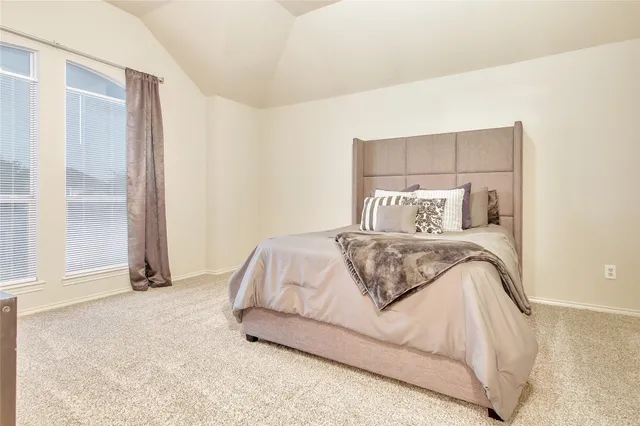 a bedroom with a bed and night stand