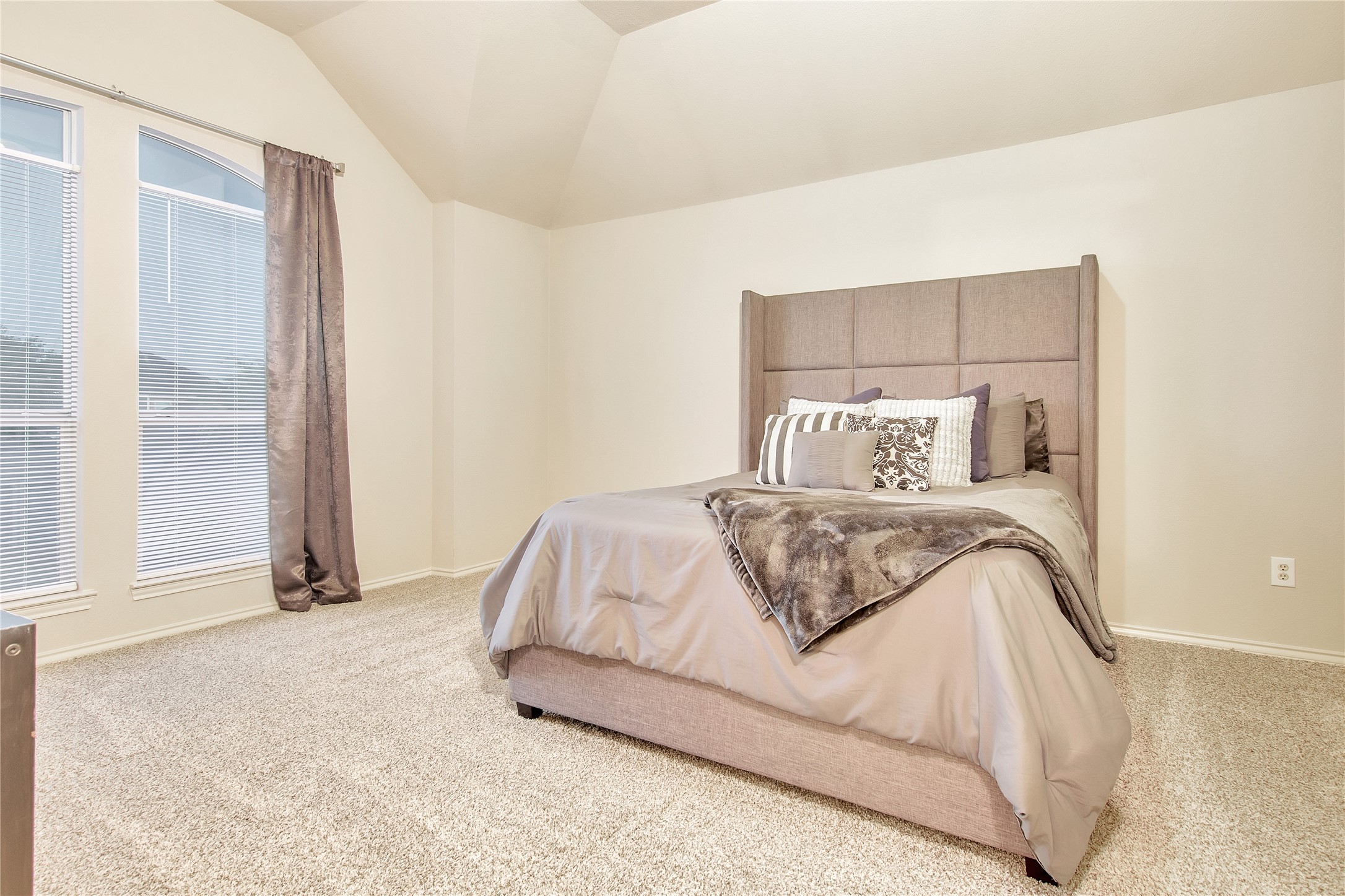 16518 Strathmore Manor Lane Houston, TX 77090 - Photo 15 of 25 a bedroom with a bed and night stand