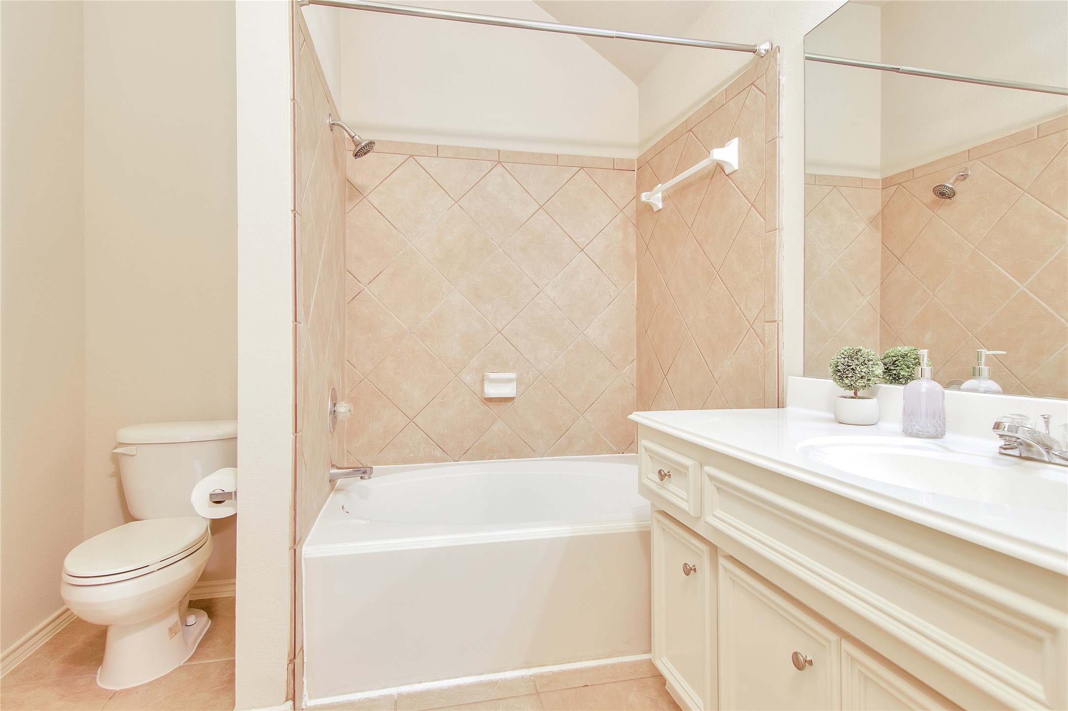 16518 Strathmore Manor Lane Houston, TX 77090 - Photo 17 of 25 a bathroom with a sink a toilet and a bathtub