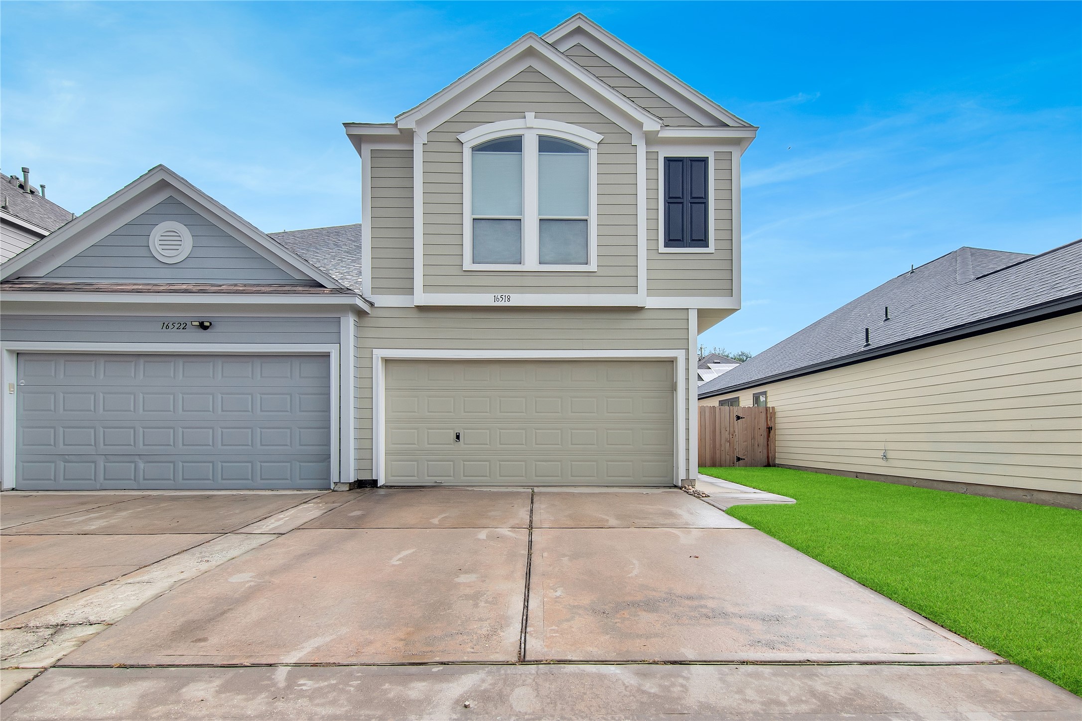 16518 Strathmore Manor Lane Houston, TX 77090 - Photo 2 of 25 a front view of a house with a garage
