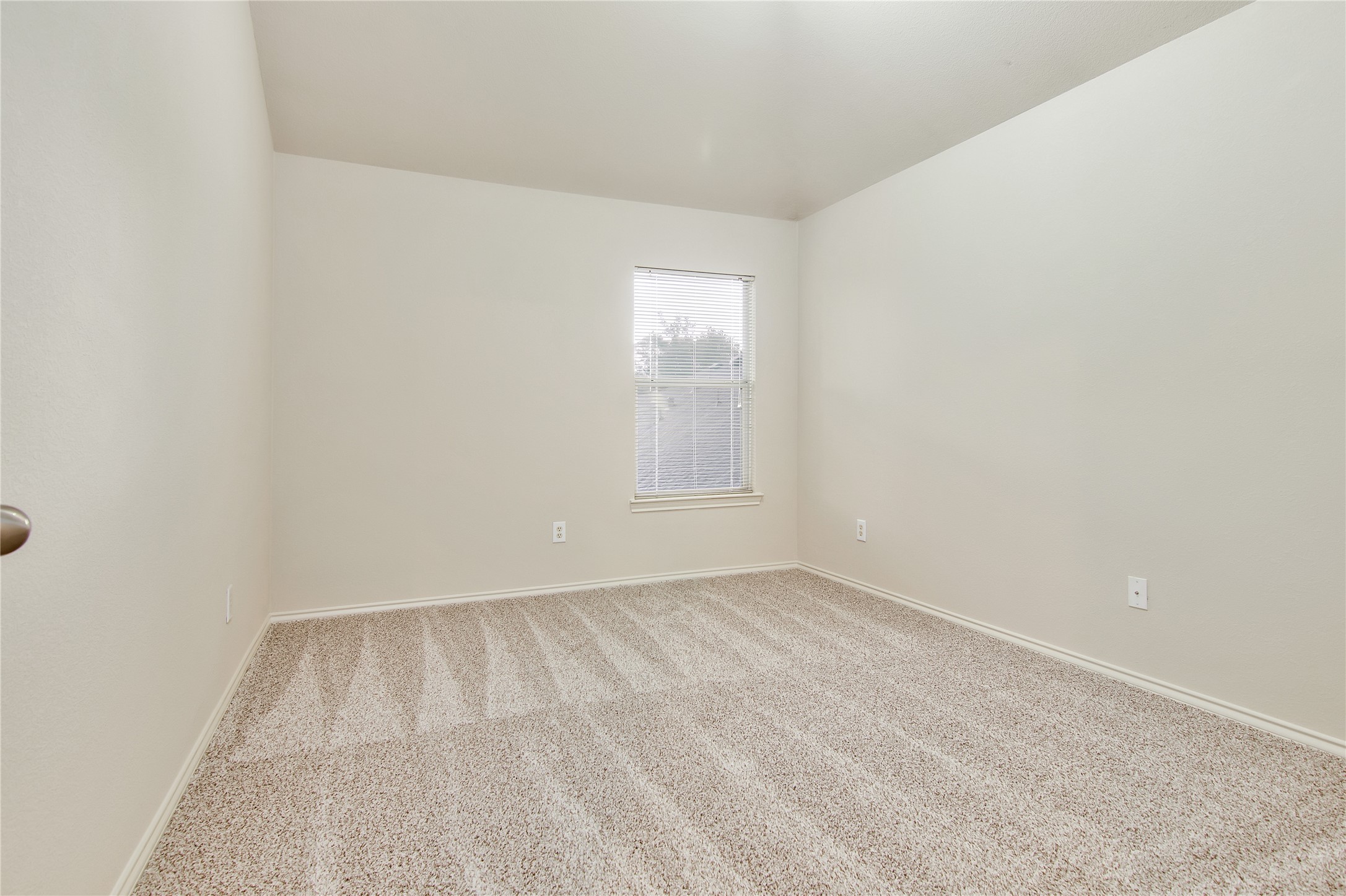 16518 Strathmore Manor Lane Houston, TX 77090 - Photo 22 of 25 a view of room with window
