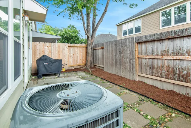 a wooden table sitting in front of a house