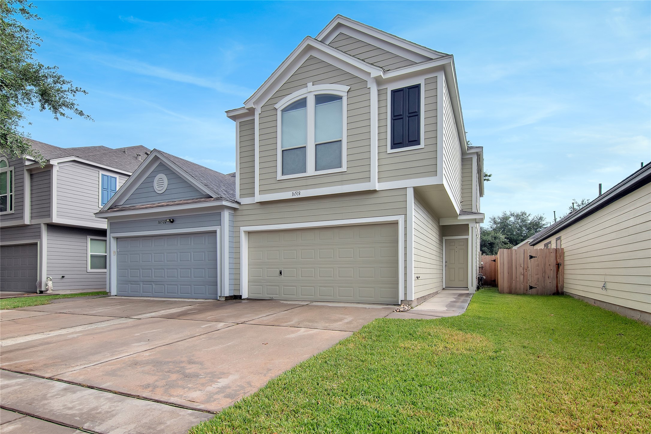16518 Strathmore Manor Lane Houston, TX 77090 - Photo 3 of 25 a view of a house with a yard