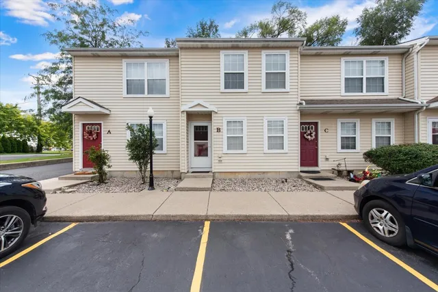 a view of a car parked in front of a house