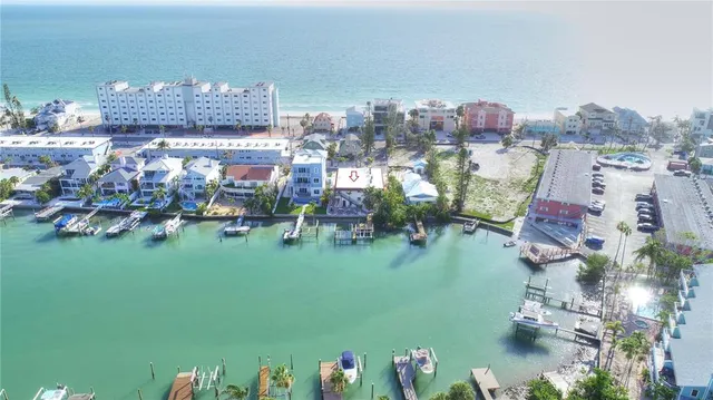 an aerial view of a house with a lake view