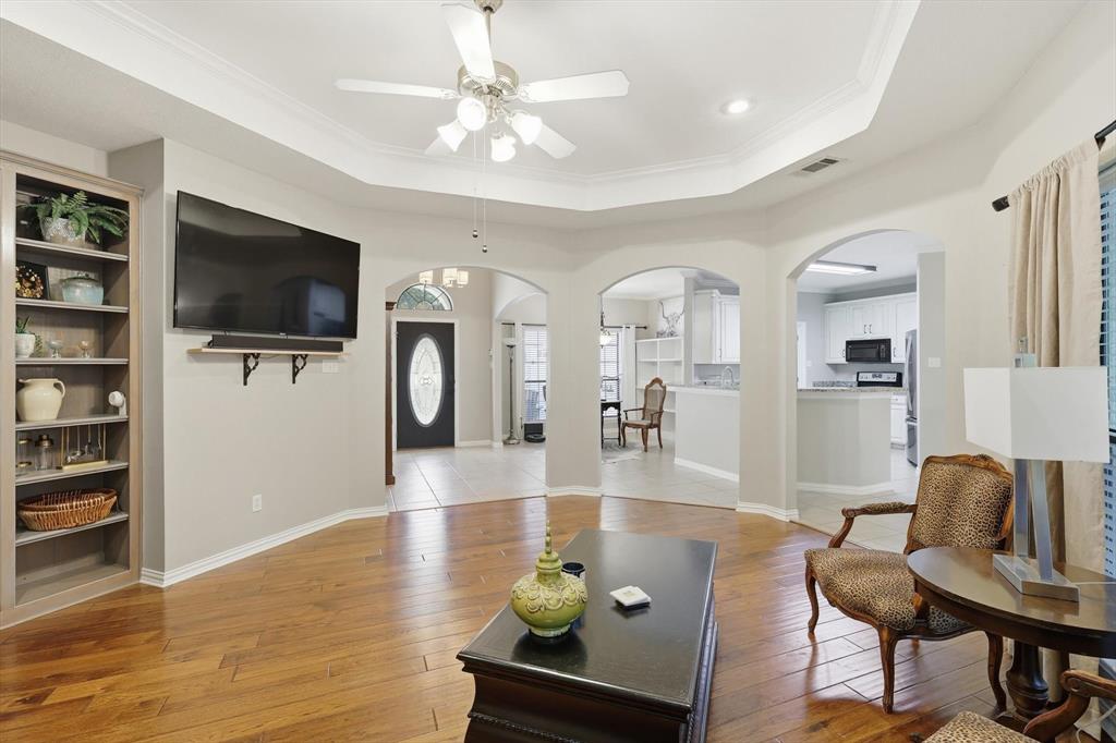 1805 Spinnaker Lane Azle, TX 76020 - Photo 11 of 40 a living room with furniture and a flat screen tv