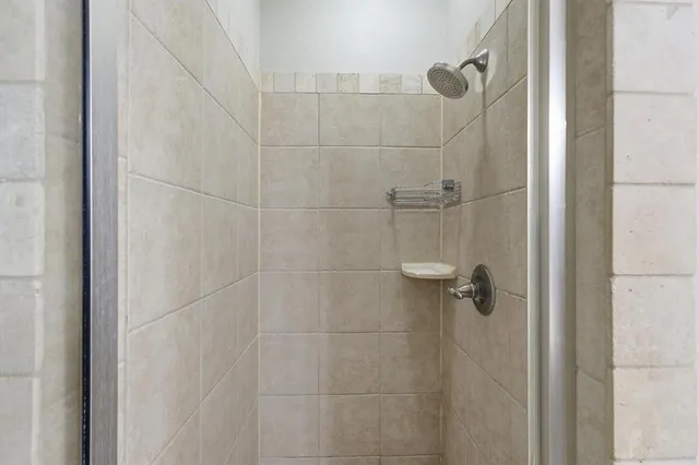 a large en suite bathroom with a tub sink and mirror