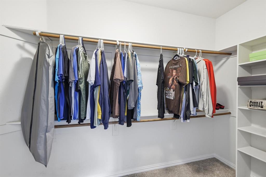 1805 Spinnaker Lane Azle, TX 76020 - Photo 26 of 40 a view of walk in closet with clothes
