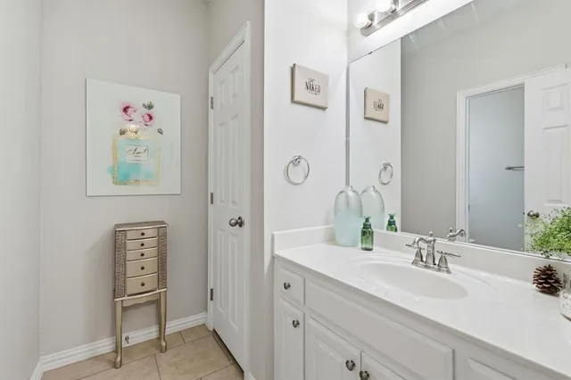 a bathroom with a sink toilet and vanity