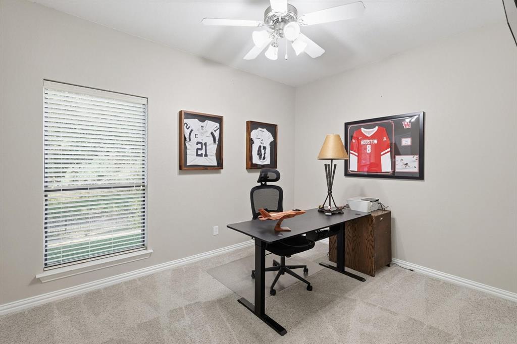 1805 Spinnaker Lane Azle, TX 76020 - Photo 30 of 40 a view of a workspace with furniture and a window