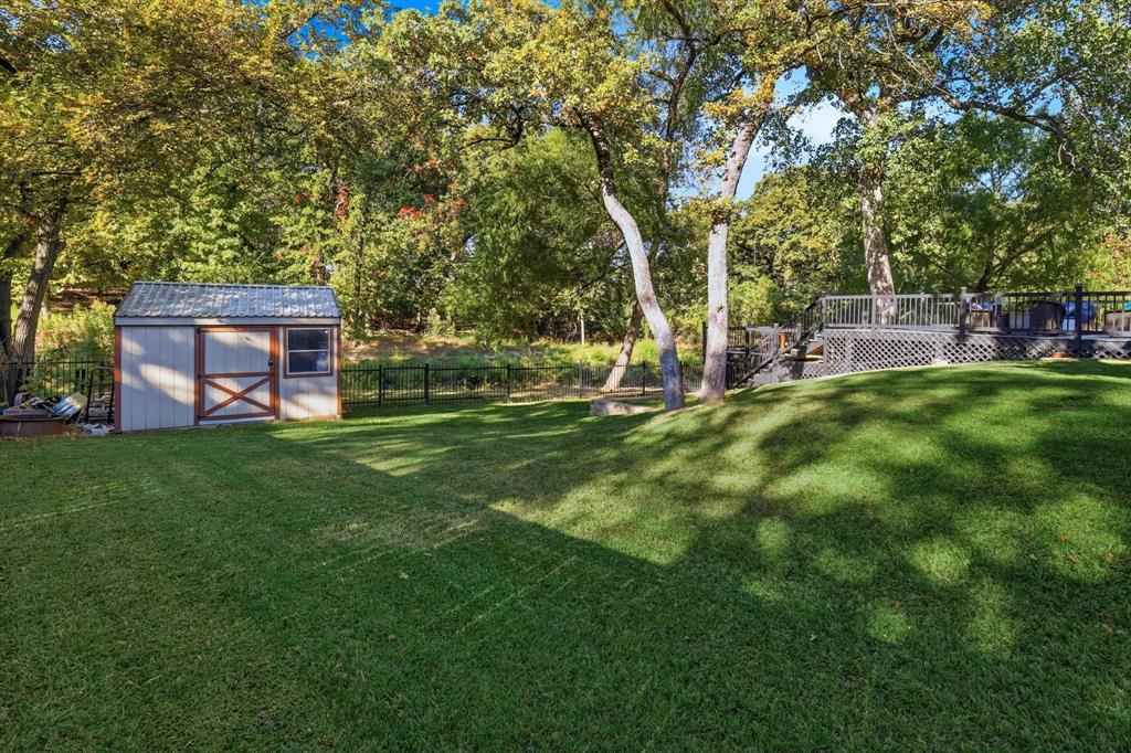 1805 Spinnaker Lane Azle, TX 76020 - Photo 34 of 40 a view of a house with a backyard