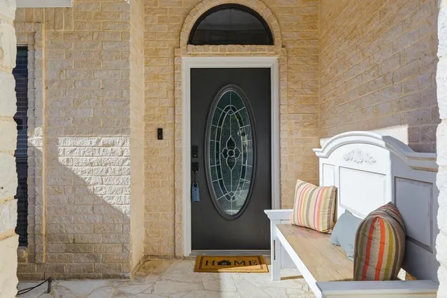 a view of front door with washer and dryer