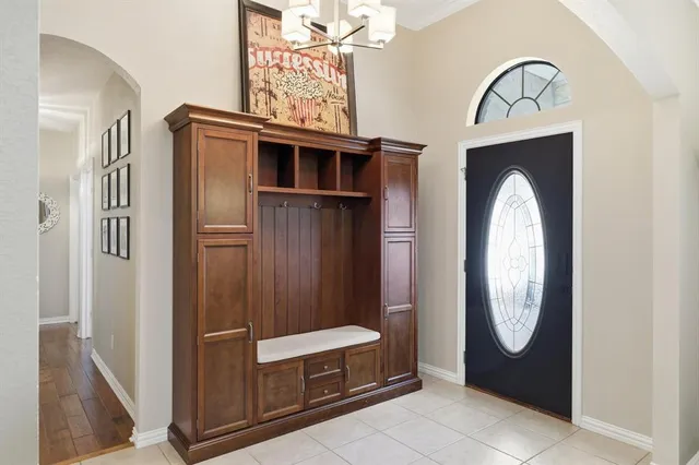 a view of an entryway with wooden floor